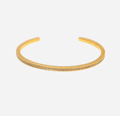 Bracelet de charme doré, élégant et minimaliste, style vintage/rétro, accessoire parfait pour un look sophistiqué.